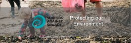 image of beach with child picking up rubbish