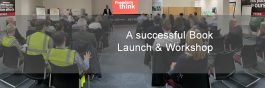 image of people sat in rows viewing presentation