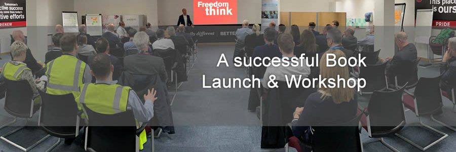 image of people sat in rows viewing presentation