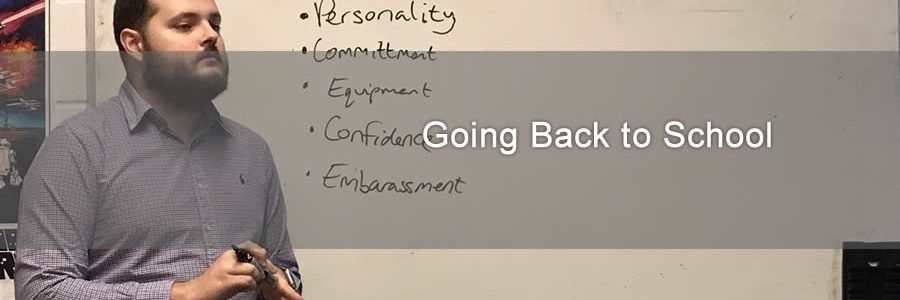 James talking in front of white board