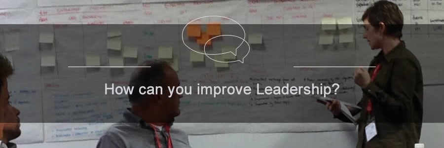 image of a team developing leadership skills at a leadership workshop with postit notes on the board